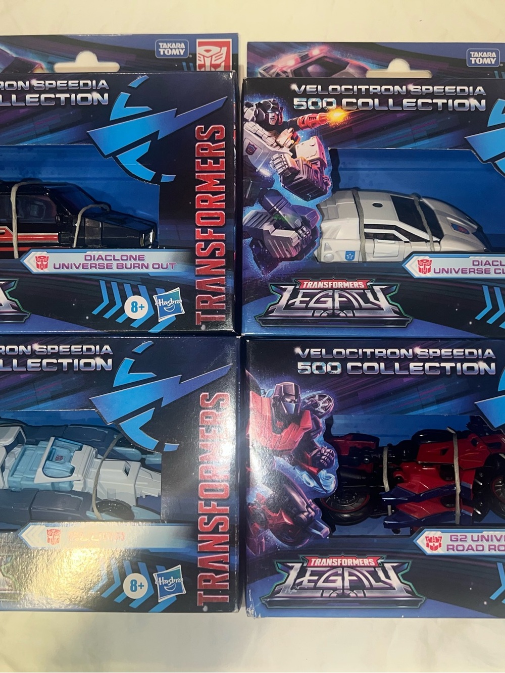 Takara Transformers Velocitron Speedia 500 Collection - White, Red, Black, Blue